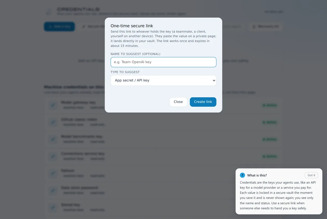 The credentials screen of the running product with the one-time secure link panel open. The stored keys listed behind it show a name and a status only, never a value. The panel explains that the link can be used once and expires in about fifteen minutes.